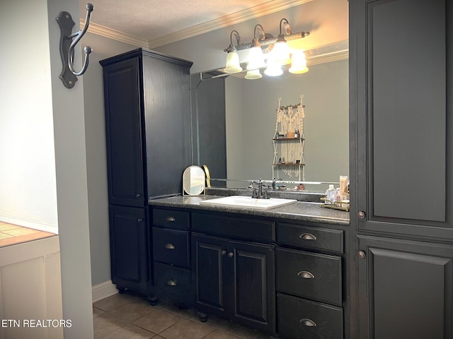 bathroom with ornamental molding, tile patterned flooring, a textured ceiling, and vanity