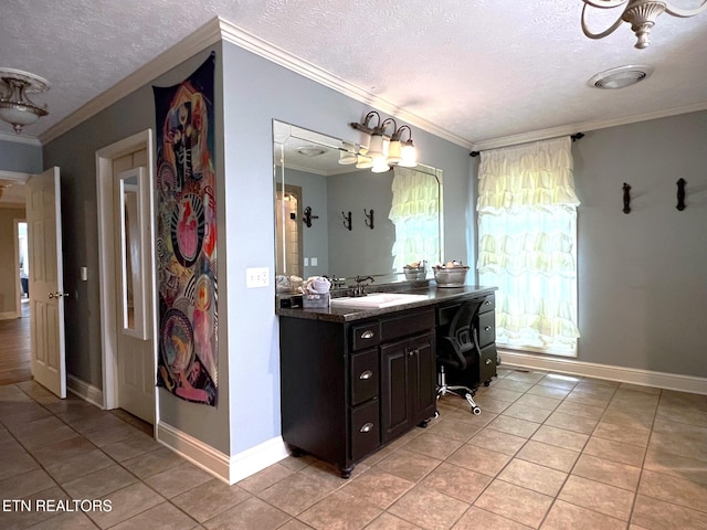 bathroom with vanity, crown molding, tile patterned floors, and a textured ceiling