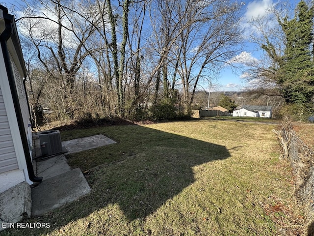 view of yard with central AC unit