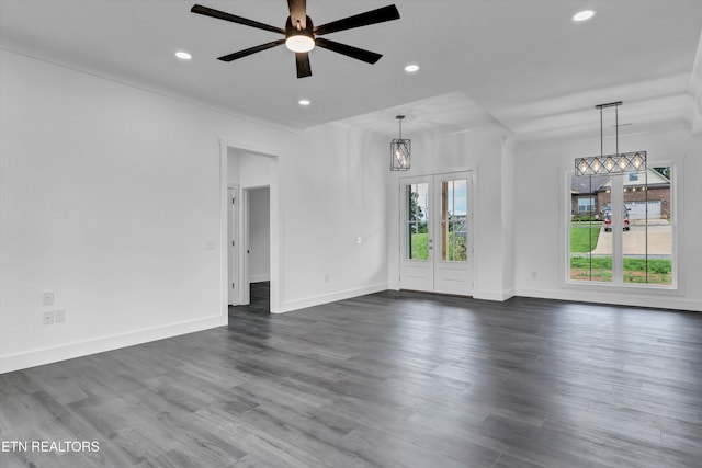 unfurnished room featuring french doors, ceiling fan, plenty of natural light, and dark hardwood / wood-style floors