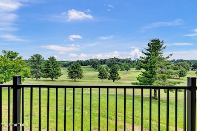 view of yard with a balcony