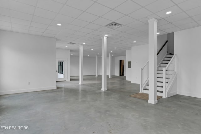 basement featuring a drop ceiling