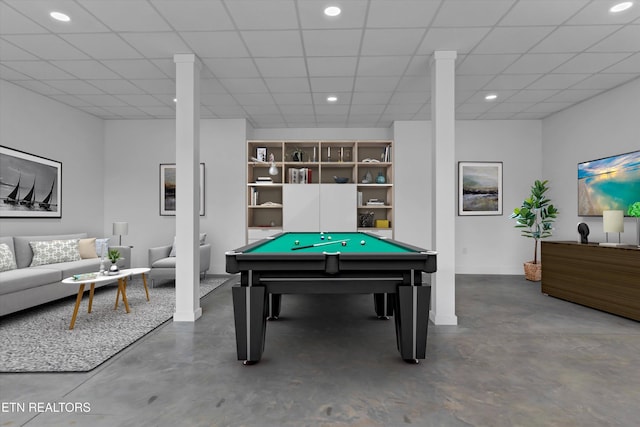 playroom with a paneled ceiling, concrete flooring, and pool table