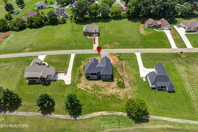 birds eye view of property featuring a rural view