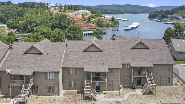 birds eye view of property featuring a water and mountain view