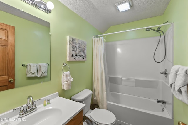 full bathroom featuring vanity, shower / tub combo with curtain, a textured ceiling, and toilet