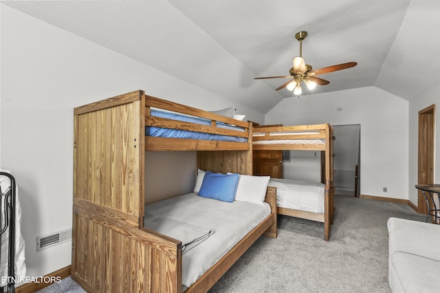 carpeted bedroom with vaulted ceiling and ceiling fan