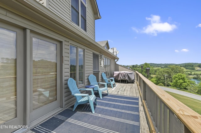 wooden deck featuring area for grilling