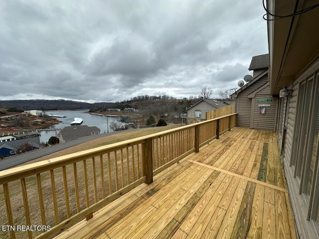 wooden deck featuring a water view