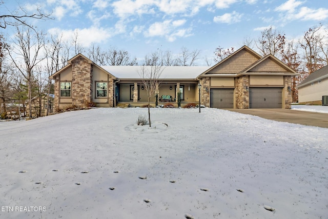 view of front of home with covered porch and a garage