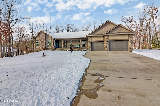 view of front of home with covered porch and a garage