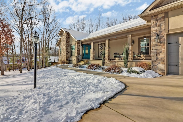 view of front of house featuring a garage and covered porch