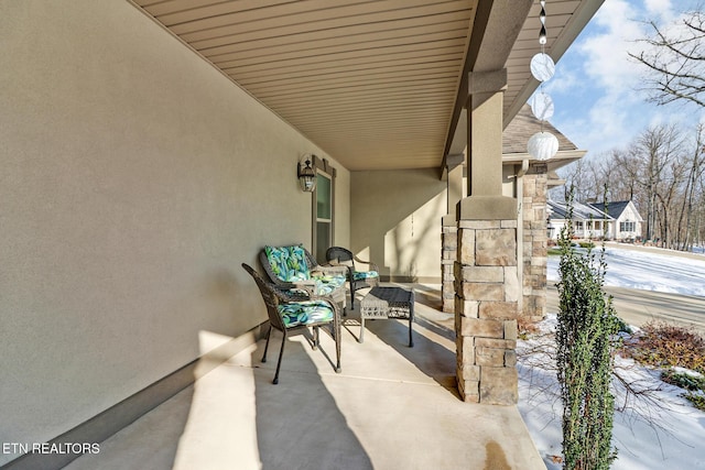 view of snow covered patio