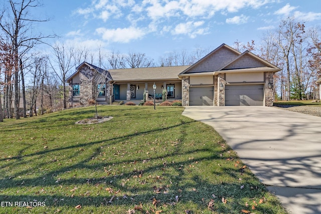 single story home featuring a porch, a garage, and a front lawn