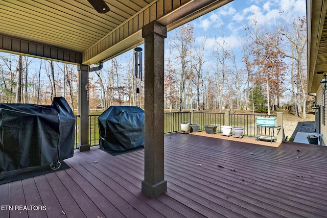 deck with a grill and ceiling fan