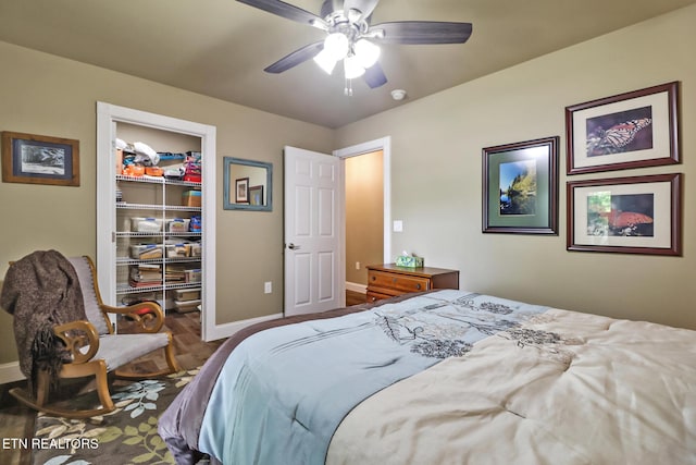 153 Walden Ridge Dr, Fairfield Glade, TN 38558 - bedroom featuring baseboards, a walk in closet, a closet, ceiling fan, and wood finished floors