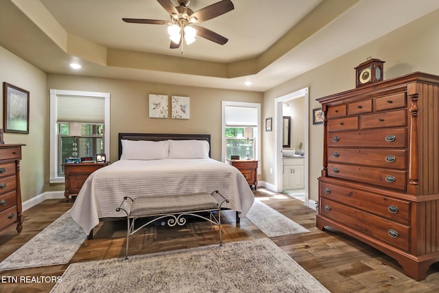 153 Walden Ridge Dr, Fairfield Glade, TN 38558 - bedroom with multiple windows, baseboards, dark wood finished floors, and recessed lighting