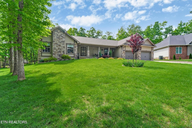 153 Walden Ridge Dr, Fairfield Glade, TN 38558 - view of front of property with an attached garage, stone siding, and a front yard