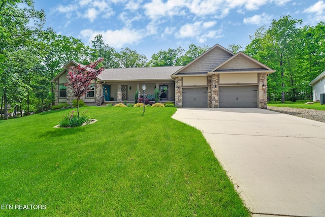 153 Walden Ridge Dr, Fairfield Glade, TN 38558 - view of front facade featuring a garage, concrete driveway, a front lawn, stone siding, and stucco siding