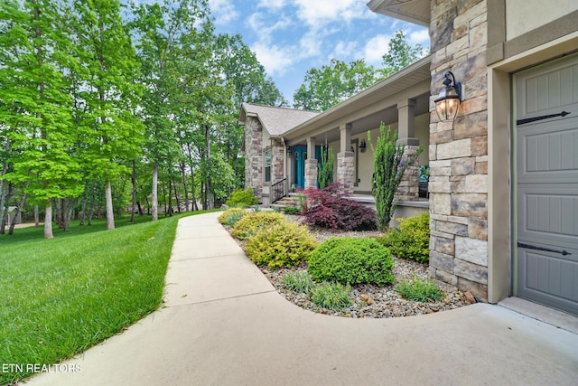 153 Walden Ridge Dr, Fairfield Glade, TN 38558 - property entrance featuring stone siding and a yard