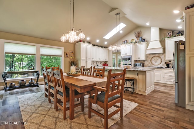 153 Walden Ridge Dr, Fairfield Glade, TN 38558 - dining area with dark wood-style flooring, a chandelier, recessed lighting, and high vaulted ceiling