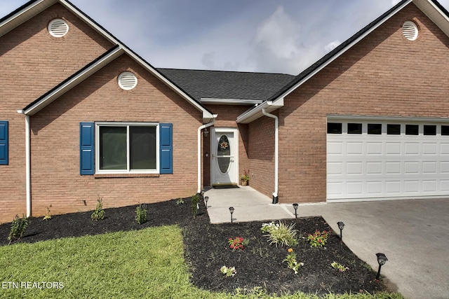 view of front of property with a garage