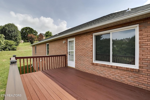 deck featuring a lawn