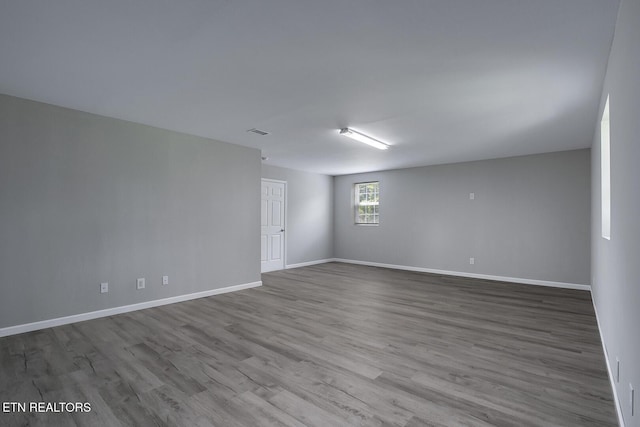 spare room with light hardwood / wood-style flooring