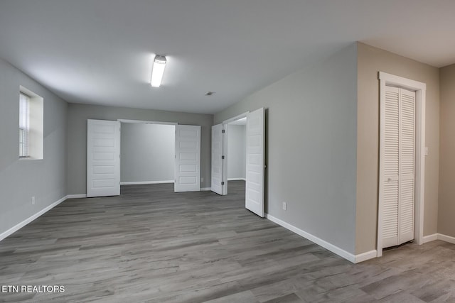 unfurnished bedroom featuring light wood-type flooring