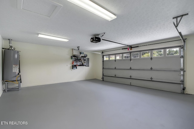 garage featuring a garage door opener, water heater, and electric panel