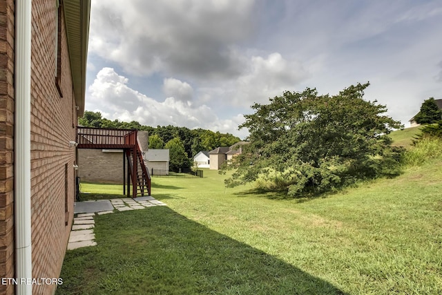 view of yard with a deck