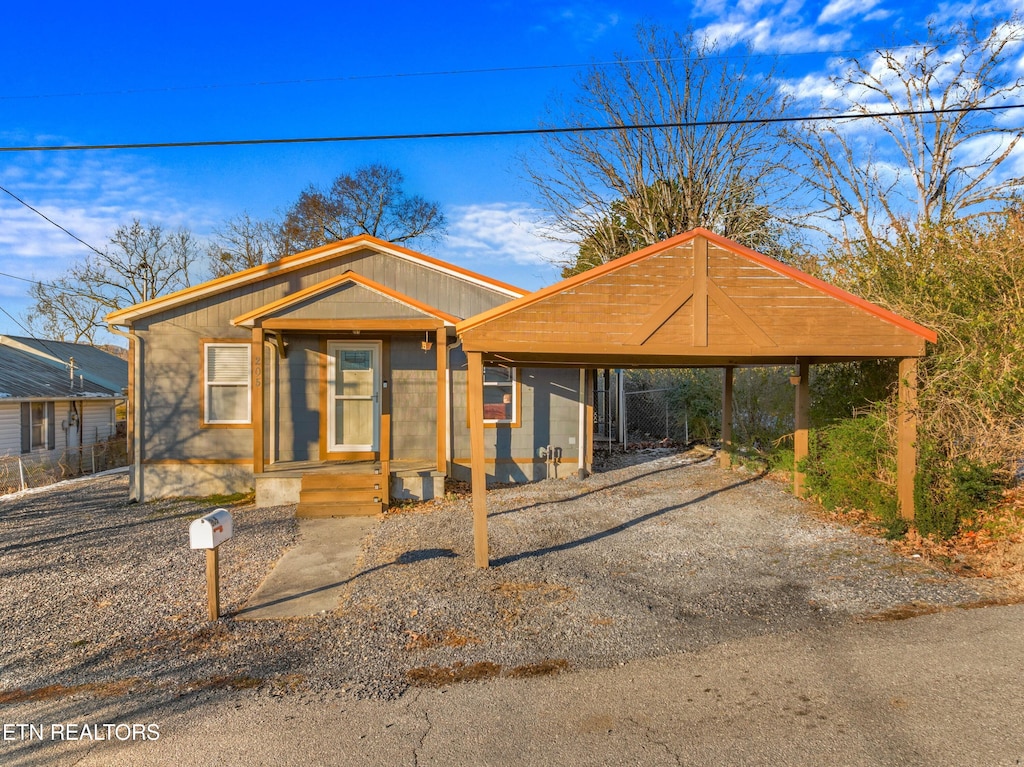 view of front of home with a carport