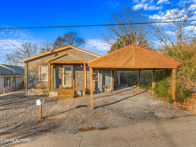 view of front of home with a carport