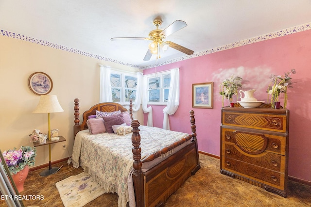 bedroom featuring dark colored carpet and ceiling fan