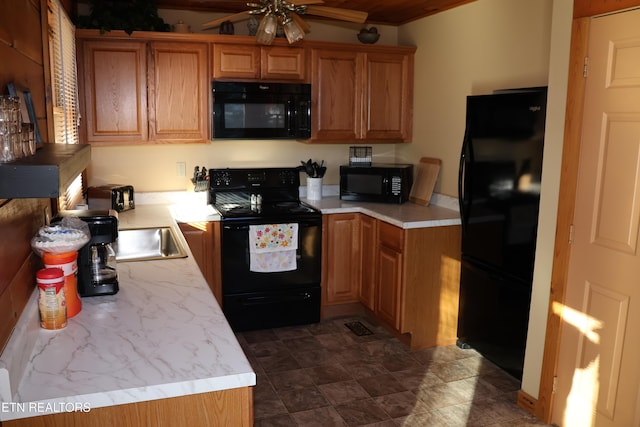 kitchen featuring black appliances, ceiling fan, and sink