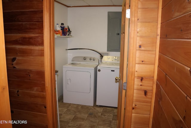 laundry room with electric panel and independent washer and dryer