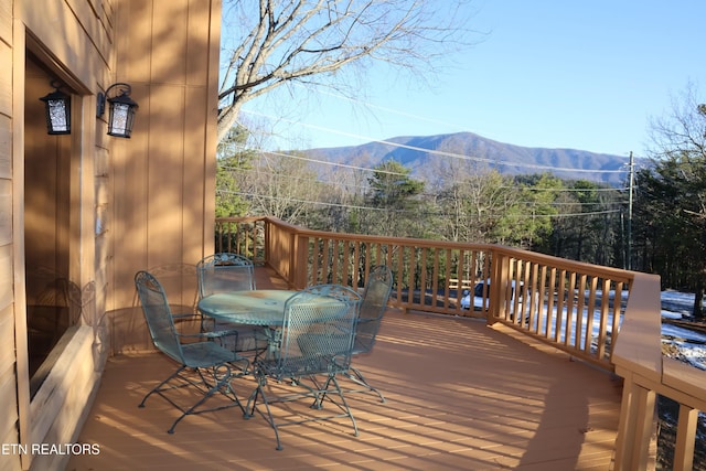 wooden terrace featuring a mountain view