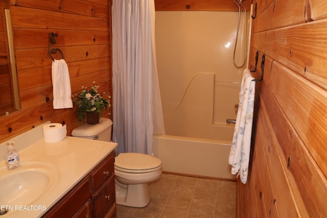 full bathroom featuring shower / bathtub combination with curtain, vanity, tile patterned floors, toilet, and wood walls