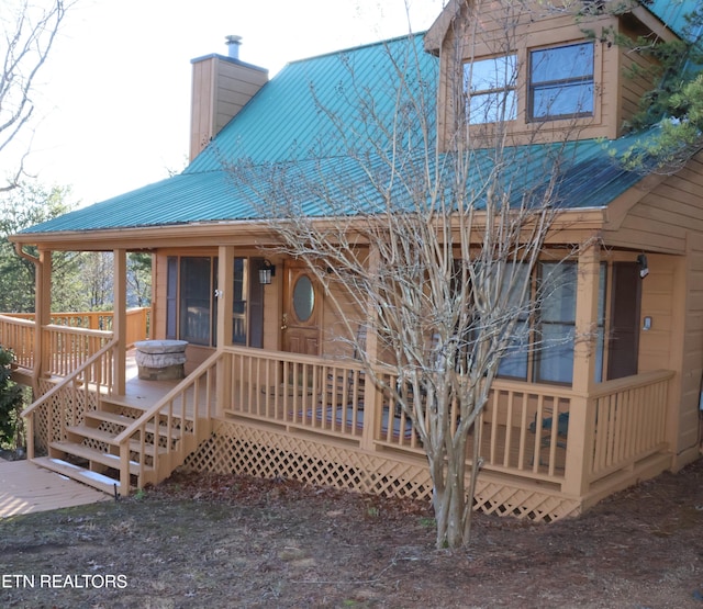 3850 Millers Ridge Way, Sevierville, TN 37862 - back of property with a chimney, metal roof, and a porch