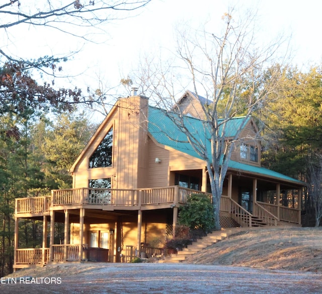 3850 Millers Ridge Way, Sevierville, TN 37862 - view of front of home featuring a chimney, metal roof, and covered porch