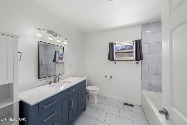 bathroom with toilet and vanity