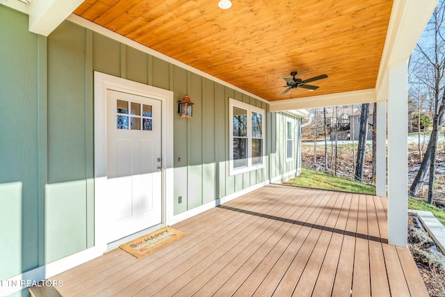 wooden terrace featuring ceiling fan