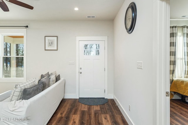 entrance foyer with ceiling fan and dark hardwood / wood-style floors