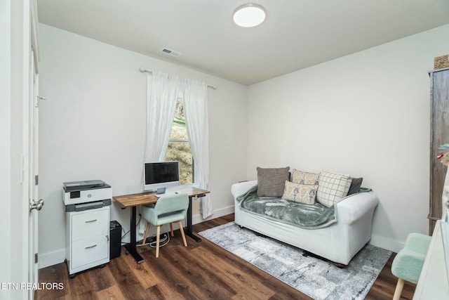 home office with dark hardwood / wood-style floors