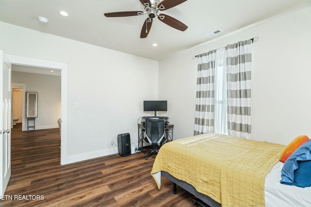 bedroom with ceiling fan and dark hardwood / wood-style flooring