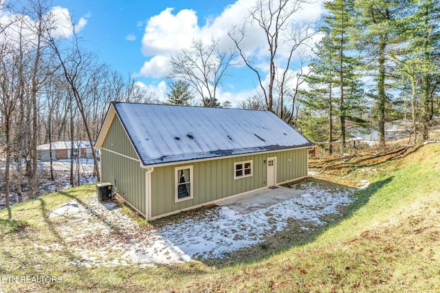 view of property exterior with central AC