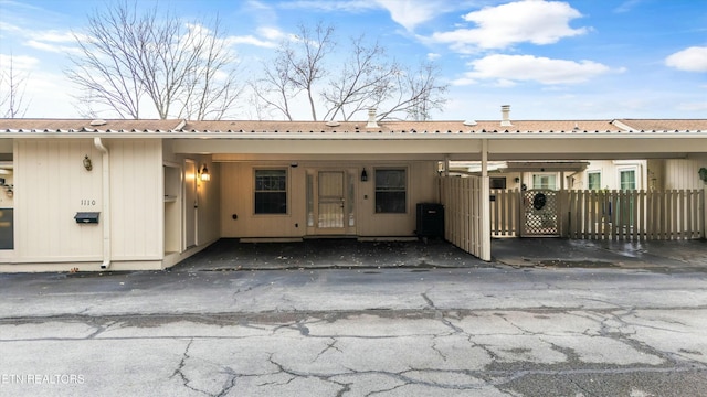 exterior space featuring a carport