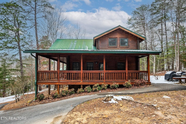 cabin featuring a porch