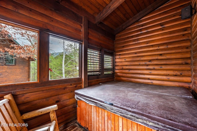 unfurnished sunroom with wood ceiling, lofted ceiling with beams, and a jacuzzi