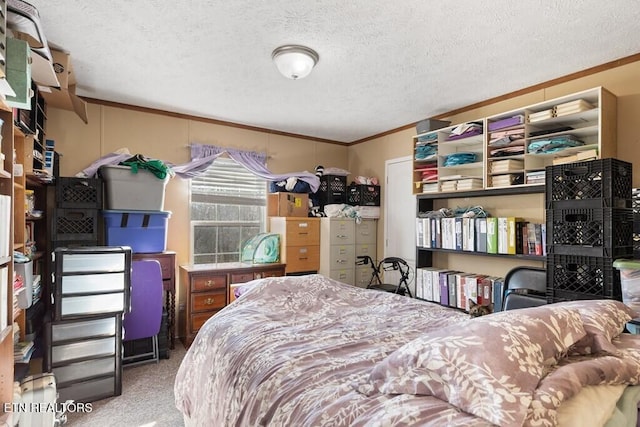 bedroom with carpet floors, a textured ceiling, and ornamental molding